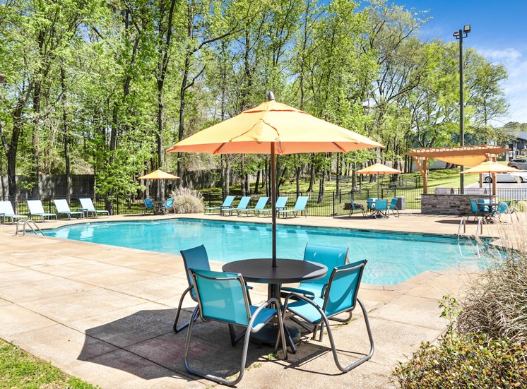 swimming pool, picnic table with umbrella, and large sundeck